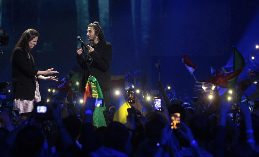 Salvador Sobral from Portugal, right, performs the song "Amar pelos dois" with his sister Luisa after winning the Final of the Eurovision Song Contest, in Kiev, Ukraine, Saturday, May 13, 2017. (AP Photo/Efrem Lukatsky)