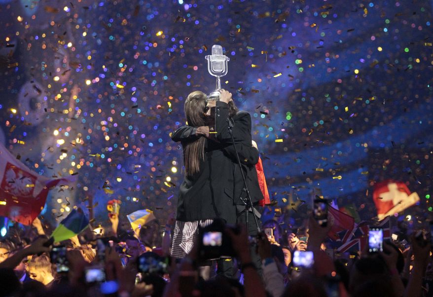 Salvador Sobral from Portugal, right, embraces his sister Luisa after performing the song "Amar pelos dois" following his win in the Final of the Eurovision Song Contest, in Kiev, Ukraine, Saturday, May 13, 2017. (AP Photo/Efrem Lukatsky)