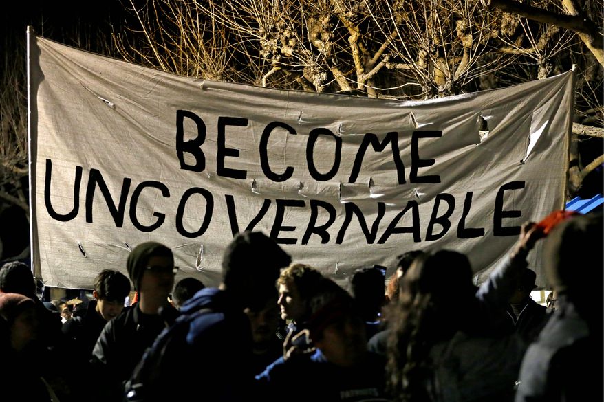 Protesters against a speech appearance by Milo Yiannopoulos march on the University of California, Berkeley campus Feb. 1. (Associated Press)