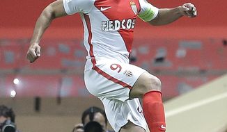 Monaco&#39;s Radamel Falcao celebrates after scoring during a League One soccer match between Monaco and Lille, at the Louis II stadium, in Monaco, Sunday, May, 14 2017. (AP Photo/Claude Paris)