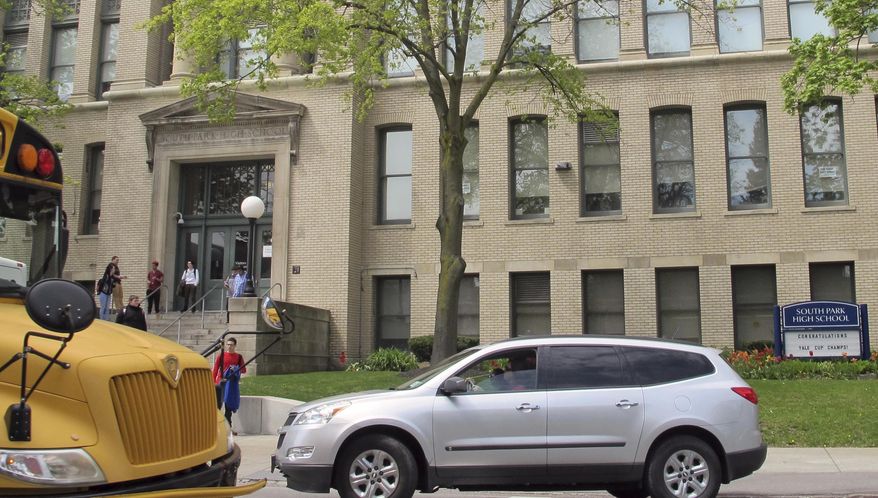 In this May 10, 2017 photo, students leave South Park High School in Buffalo, N.Y. The Medicaid changes being advanced as part of the health overhaul are sounding familiar alarms for school districts still getting their financial footing after the Great Recession. (AP Photo/Carolyn Thompson)