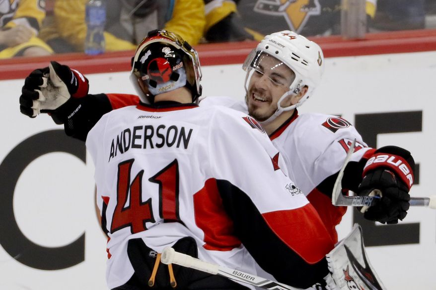Ottawa Senators' Jean-Gabriel Pageau, right, celebrates with goalie Craig Anderson after defeating the Pittsburgh Penguins in the overtime period of Game 1 of the Eastern Conference final in the NHL hockey Stanley Cup playoffs, Saturday, May 13, 2017, in Pittsburgh. Ottawa won 2-1 in overtime. (AP Photo/Gene J. Puskar)
