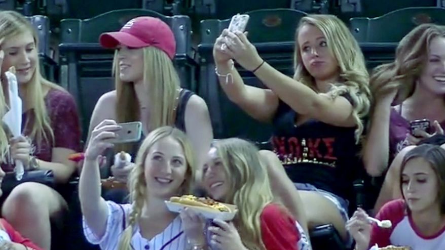 FOX Sports caught these Sorority girls who were more interested in taking the perfect selfie than watching the game