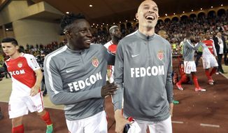 Monaco&#39;s Benjamin Mendy, left, Monaco&#39;s Andrea Raggi, react after defeating Lille during a League One soccer match between Monaco and Lille, at the Louis II stadium, in Monaco, Sunday, May, 14 2017. (AP Photo/Claude Paris)