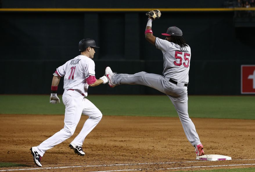 Pittsburgh Pirates' Josh Bell (55) makes a catch at first base to get Arizona Diamondbacks' A.J. Pollock (11) out during the sixth inning of a baseball game Sunday, May 14, 2017, in Phoenix. The Pirates defeated the Diamondbacks 6-4. (AP Photo/Ross D. Franklin)