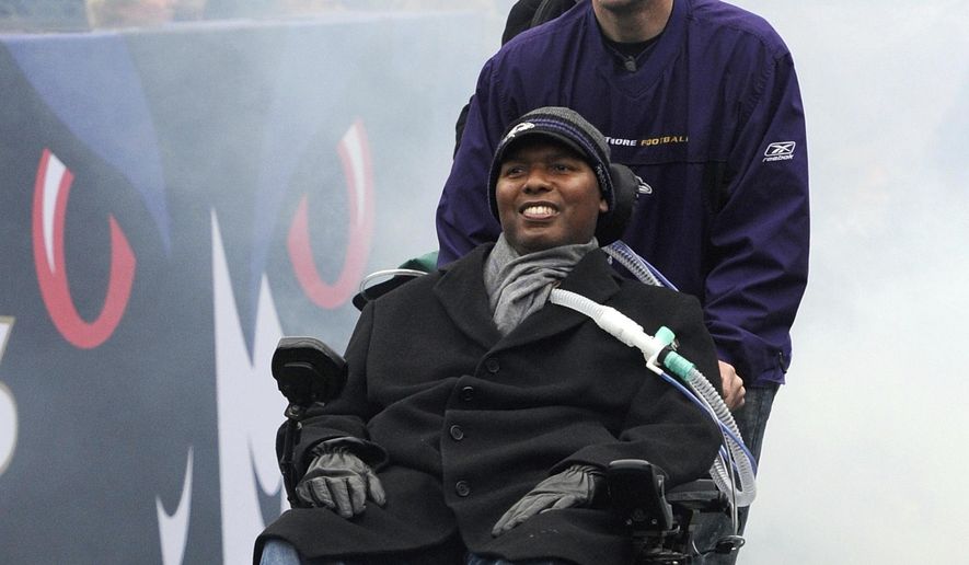 FILE - In this Feb. 5, 2013, file photo, O.J. Brigance, front, attends a celebration in Baltimore of the NFL football team's Super Bowl victory. Brigance will hold a celebration Tuesday, May 16, on the 10th anniversary of a day that forever changed his life. On May 16, 2007, the former Ravens linebacker learned he was afflicted with amyotrophic lateral sclerosis. There is no known cure for what is commonly known as Lou Gehrig’s disease, and the life expectancy after being diagnosed is usually two to five years. Only 10 percent of those with ALS live 10 years beyond the diagnosis, which explains why Brigance and his wife, Chanda, intend to savor the moment. Brigance serves as senior adviser to player engagement for the Ravens, a job he started in 2004. In addition to assisting players in each phase of their career, Brigance is a source of motivation. (AP Photo/Steve Ruark, File)