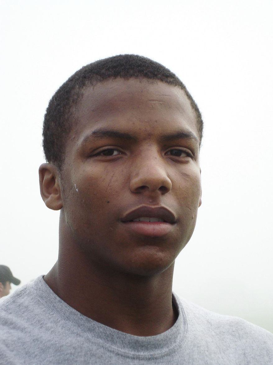 This undated photo shows Marques Mondy, a member of the Forest Hills Central High School football team in Grands Rapids, Mich. After the Division I basketball prospect assaulted a classmate in a darkened band room at their suburban Michigan high school, a judge ordered him into adolescent sex offender treatment _ for the second time. (Grand Rapids Press via AP)