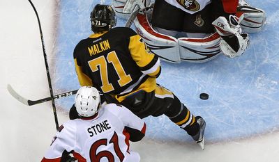 Ottawa Senators goalie Craig Anderson (41) stops a shot by Pittsburgh Penguins&#39; Evgeni Malkin (71) during the first period of Game 2 of the Eastern Conference final with Mark Stone (61) defending in the NHL Stanley Cup hockey playoffs in Pittsburgh, Monday, May 15, 2017.(AP Photo/Gene J. Puskar)