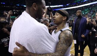 Washington Wizards guard John Wall, left, and Boston Celtics guard Isaiah Thomas speak on the court after Game 7 of a second-round NBA basketball playoff series, Monday, May 15, 2017, in Boston. The Celtics won 115-105 to advance to the Eastern Conference championship series. (AP Photo/Charles Krupa)