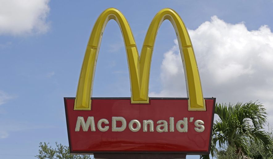 This Tuesday, June 28, 2016, file photo shows the sign at a McDonald's restaurant, in Miami. On June 16, 2017, CNNMoney reported the fast food chain and the International Olympic Committee have agreed to ending their partnership effectively immediately, three years earlier than intended. (AP Photo/Alan Diaz, File) **FILE**