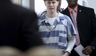FILE - In this Monday, April 10, 2017, file photo, Dylann Roof enters the court room at the Charleston County Judicial Center to enter his guilty plea on murder charges in Charleston, S.C. Federal officials are for the first time showing videos of convicted the South Carolina church shooter&#39;s jailhouse visits with his family on Tuesday, May 16. (Grace Beahm/The Post And Courier via AP, Pool, File)