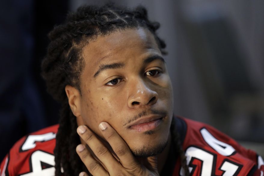 FILE - In this Feb. 2, 2017, file photo, Atlanta Falcons running back Devonta Freeman listens to a question during a media availability for the NFL Super Bowl 51 football game, in Houston. Freeman's contract status is one of the Falcons' biggest remaining offseason priorities. Talks continue on a contract extension for the running back who can be an unrestricted free agent after the 2017 season. (AP Photo/Eric Gay, File)