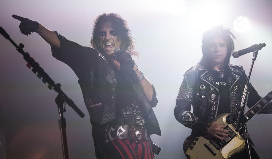 FILE - In this Nov. 6, 2015 file photo, Alice Cooper, left, performs at Wembley Arena in London. Many of the rock ‘n’ roll bands that were huge in 1977 will comprise a big part of the summer concert market 40 years later. Concert industry executives say nostalgia acts are still reliable sellers, with satellite and classic rock radio keeping their hits alive. (Photo by Joel Ryan/Invision/AP, File)