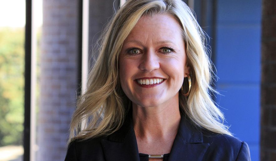 In this May 12, 2017 photo, New Mexico's Children, Youth and Families Secretary Monique Jacobson poses in Albuquerque, N.M. Jacobson said her department has been focusing on retention efforts to boost the number of foster families around the state and to help those interested in becoming foster parents navigate the rigorous certification process. (AP Photo/Susan Montoya Bryan)