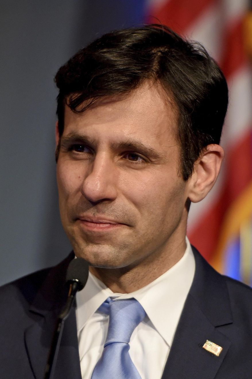 In this April 26, 2017 photo shown is Democrat candidate for Philadelphia District Attorney Joe Khan appearing in a debate sponsored by WHYY and the NAACP in Philadelphia. The typically sedate race for Philadelphia District Attorney has become an intriguing contest this year as eight newcomers vie for a job that helps shape city policy on sanctuary cities, police use of force and prison reform. They hope to succeed Democrat Seth Williams, who goes on trial next month in a federal bribery case. (Tom Gralish/The Philadelphia Inquirer via AP)