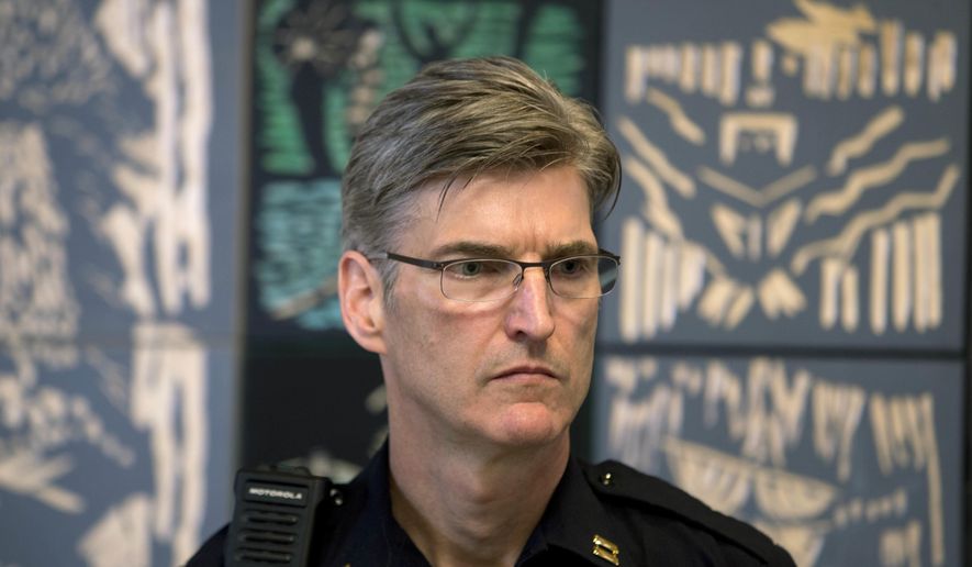 FILE- This June 27, 2016 file photo shows Portland Police Capt. Mike Marshman at a ceremony before he is announced as the new Police Chief in Portland, Ore. Portland has begun the search for a new police chief--a search that comes as the bureau is struggling with a staffing shortage, its controversial handling of large-scale protests, a recent officer-involved fatal shooting of a black teenager and the adoption of policy, training and accountability reforms required under a settlement agreement with the U.S. Department of Justice. (Beth Nakamura/The Oregonian/Oregon live via AP, file)/The Oregonian via AP)