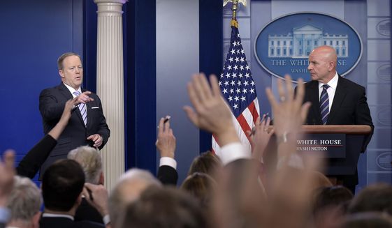 White House press secretary Sean Spicer, left, calls on a reporter as National Security Adviser H.R. McMaster listens at right during a briefing at the White House in Washington, Tuesday, May 16, 2017. President Donald Trump claimed the authority to share &amp;quot;facts pertaining to terrorism&amp;quot; and airline safety with Russia, saying in a pair of tweets he has &amp;quot;an absolute right&amp;quot; as president to do so. (AP Photo/Susan Walsh)