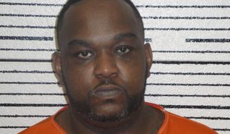 This undated booking photograph released by the Greene County Sheriff&#x27;s Office in Eutaw, Ala., shows Donnovan Johnson, who was arrested in Chicago on May 12, 2017, almost 20 years after escaping while awaiting trial in a 1996 slaying in Alabama. Authorities said Johnson has been returned to Alabama to face charges in the slaying of 29-year-old Ollie Carpenter. (Greene County Sheriff&#x27;s Office/AL.com via AP)
