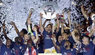Monaco players celebrate their French League One title after beating Saint Etienne during the League One soccer match Monaco against Saint Etienne, at the Louis II stadium in Monaco, Wednesday, May 17, 2017. Monaco clinched its first league title since 2000 and eighth overall, replacing Paris Saint-Germain as champion. (AP Photo/Claude Paris)