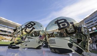 FILE - In this Dec. 5, 2015, file photo, Baylor helmets on shown the field after an NCAA college football game in Waco, Texas. A new federal lawsuit against Baylor University alleges football players routinely recorded gang rapes and staged dogfights in a program that fostered sexual violence. A former Baylor volleyball player identified only as Jane Doe filed the lawsuit Wednesday, May 17, 2017. (AP Photo/LM Otero, File)