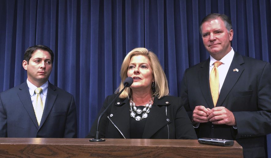 Sen. Karen McConnaughay, R-St. Charles, speaks at a news conference accompanied by Sen. Jason Barickman, R-Bloomington, right, and Sen. Bill Brady, R-Bloomington, Wednesday, May 17, 2017, in Springfield, Ill. The Republican senators were making a plea for more time to continue negotiating a budget deal with Senate Democrats. Democrats plan to call parts of the "grand bargain" budget compromise Wednesday as the clock ticks down toward the end of the legislative session. (AP Photo/John O'Connor)