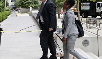 FILE - In this June 9, 2016 file photo Rear Adm. Robert Gilbeau enters the federal courthouse in San Diego. Gilbeau was sentenced Wednesday, May 17, 2017 in federal court in San Diego after pleading guilty to one count of making false statements. Gilbeau the first active-duty U.S. Navy admiral ever convicted of a federal crime was sentenced to 18 months in prison for lying to investigators about a Malaysian defense contractor at the center of a massive corruption scandal. (AP Photo/Lenny Ignelzi,File)