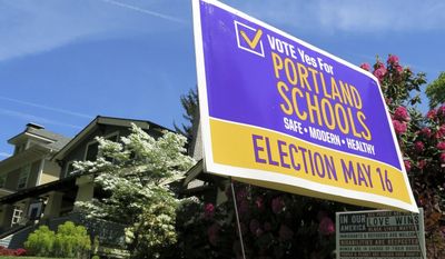 FILE--This May 9, 2017, file photo show a yard sign supporting a $790 bond measure for the Portland Public Schools in Portland, Ore. Oregon voters on Tuesday, May 16, 2017, approved two-thirds of school construction bonds statewide including the largest school bond in Oregon history with $790 million for Portland Public Schools. (AP Photo/Gillian Flaccus, file)