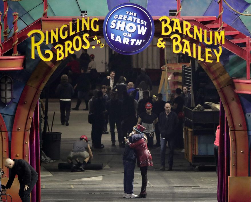 Ringmaster Kristen Michelle Wilson, right, hugs a member of the crew after the red unit's final performance, Sunday, May 7, 2017, in Providence, R.I. For the performers who travel with the Ringling Bros. and Barnum & Bailey Circus, its demise means the end of a unique way of life for hundreds of performers and crew members. (AP Photo/Julie Jacobson)