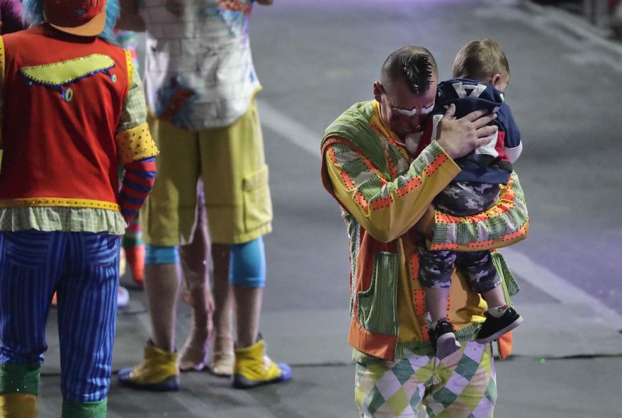 Ringling Bros. boss clown Sandor Eke hugs his 2-year-old son Michael after the red unit's final show, Sunday, May 7, 2017, in Providence, R.I. "The Greatest Show on Earth" is about to put on its last show on earth. (AP Photo/Julie Jacobson)