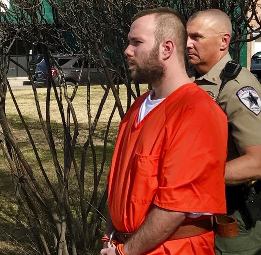 FILE - In this April 17, 2017 file photo, Dereck James Harrison is escorted to a waiting patrol car outside the Lincoln County courthouse in Kemmerer, Wyo. Harrison is set to be sentenced Wednesday May 17, 2017, one year after authorities say he and his father killed a Utah rail line worker while on the run from police after a kidnapping of a mother and her daughters. (Pat Reavy/The Deseret News via AP, File)
