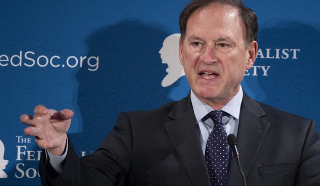 FILE -In this Nov. 17, 2016 file photo, Supreme Court Justice Samuel Alito speaks at the Federalist Society&#x27;s National Lawyers Convention in Washington. Alito is giving the graduation address at a historic Roman Catholic seminary near Philadelphia. Alito will also be awarded an honorary degree during Wednesday&#x27;s ceremony, May 17, 2017, at the Saint Charles Borromeo Seminary near Wynnewood. (AP Photo/Cliff Owen, File)