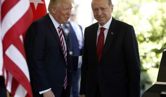 In this May 16, 2017, photo, President Donald Trump welcomes Turkish President Recep Tayyip Erdogan to the White House in Washington. The Trump administration faced growing calls Thursday for a forceful response to violence by Turkish presidential guards on American soil, who were briefly detained this week but then set free. The unseemly incident added to U.S.-Turkish tensions that are being compounded by a growing spat over U.S. war strategy against the Islamic State group in Syria. (AP Photo/Pablo Martinez Monsivais, File)