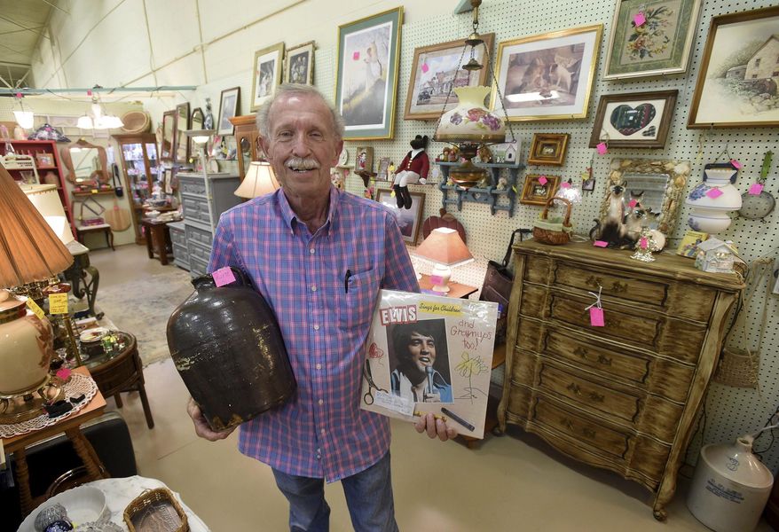 ADVANCE FOR USE SUNDAY, MAY 21, 2017 AND THEREAFTER - In this May 11, 2017 photo, Joey Ouellette, one of the original vendors at the Wildwood Antique Mall, poses in Lakeland, Fla. The Mall opened last July and has about 280 vendors. (Scott Wheeler/The Ledger via AP)