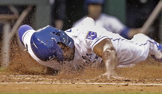 Kansas City Royals&#x27; Jorge Soler slides home to score on a single by Drew Butera during the second inning of a baseball game against the New York Yankees on Thursday, May 18, 2017, in Kansas City, Mo. (AP Photo/Charlie Riedel)