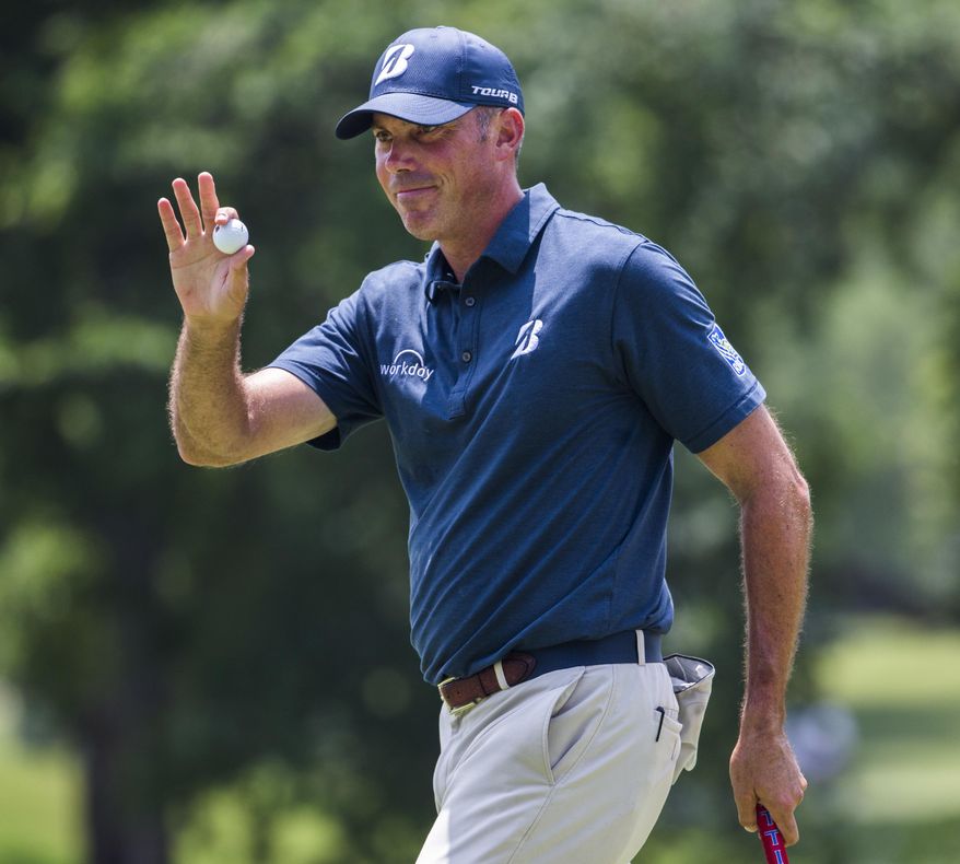 Matt Kuchar waves to spectators after sinking a shot on the ninth hole during the first round of the Byron Nelson PGA golf tournament at TPC Four Seasons Resort in Irving, Texas, Thursday, May 18, 2017. (Ashley Landis/The Dallas Morning News via AP)