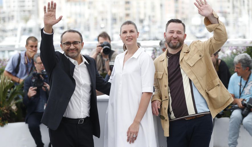 From left, director Andrey Zvyagintsev, actors Maryana Spikav and Alexei Rozin pose for photographers during the photo call for the film Loveless at the 70th international film festival, Cannes, southern France, Thursday, May 18, 2017. (AP Photo/Thibault Camus)