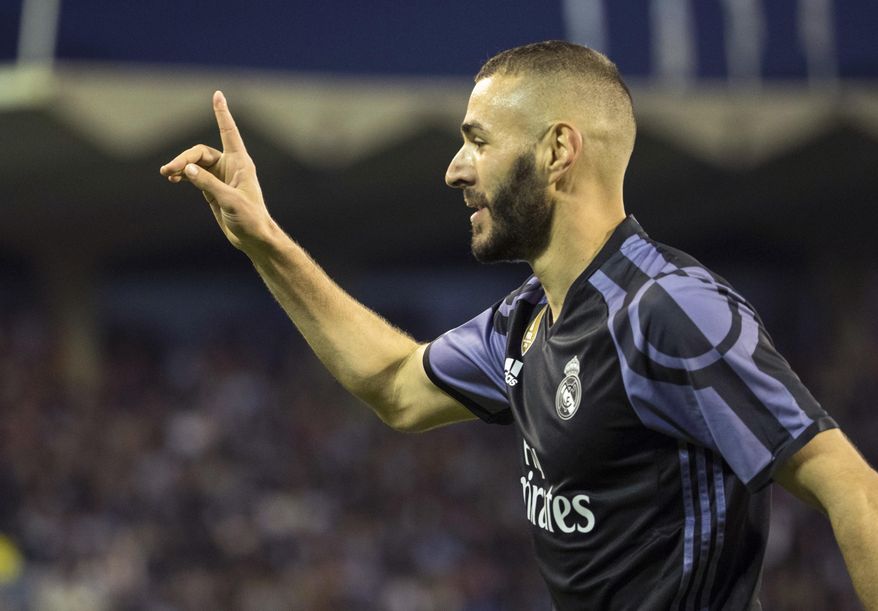Real Madrid's Karim Benzema celebrates after scoring the third goal against Celta during a Spanish La Liga soccer match between Celta and Real Madrid at the Balaidos stadium in Vigo, Spain, Wednesday, May 17, 2017. (AP Photo/Lalo R. Villar)