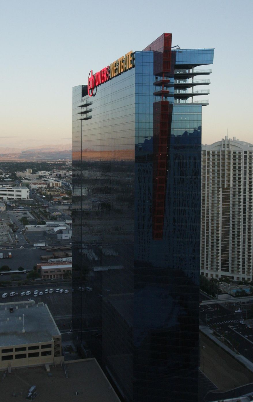 FILE--In this Oct. 20, 2009, file photo, Planet Hollywood property PH Towers Westgate is pictured near the Las Vegas Strip in Las Vegas. A tourist has filed a lawsuit against the Planet Hollywood casino-hotel on the Las Vegas Strip, claiming he was seriously injured while trying to escape his room because he was scared of a life-sized mannequin. (AP Photo/Isaac Brekken, file)