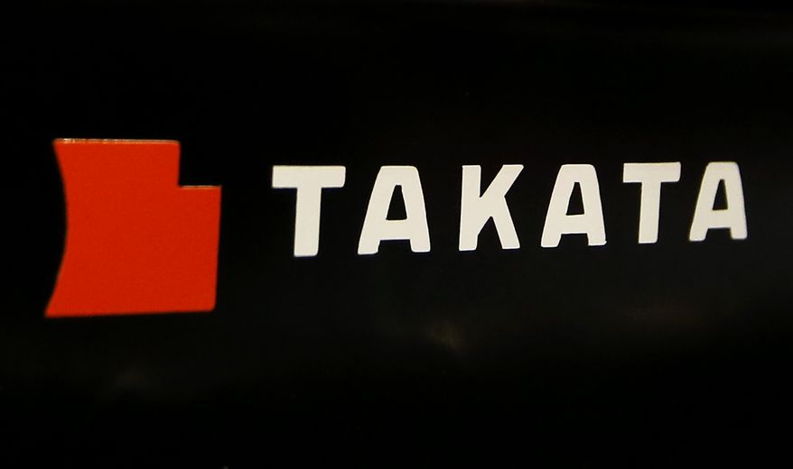 FILE - This July 6, 2016, file photo, shows the logo of Takata Corp. at an auto supply shop in Tokyo. On Thursday, May 18, 2017, Toyota, Subaru, Mazda and BMW reached a proposed settlement that would compensate owners of 15.8 million vehicles for economic losses stemming from the massive recall of Takata air bags. (AP Photo/Shizuo Kambayashi, File)