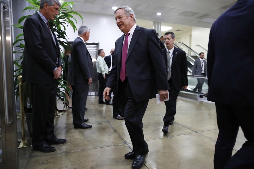 Senate Minority Whip Richard Durbin of Ill. walks on Capitol Hill in Washington, Thursday, May 18, 2017, to attend a briefing of the full Senate by Deputy Attorney General Rod Rosenstein amid controversy over President Donald Trump's firing of FBI Director James Comey. (AP Photo/Jacquelyn Martin)