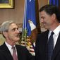 In this Sept. 4, 2013, file photo, then-incoming FBI Director James Comey talks with outgoing FBI Director Robert Mueller before Comey was officially sworn in at the Justice Department in Washington.  On May 17, 2017, the Justice Department said it is appointing Mueller as special counsel to oversee investigation into Russian interference in the 2016 presidential election. (AP Photo/Susan Walsh, File) **FILE**