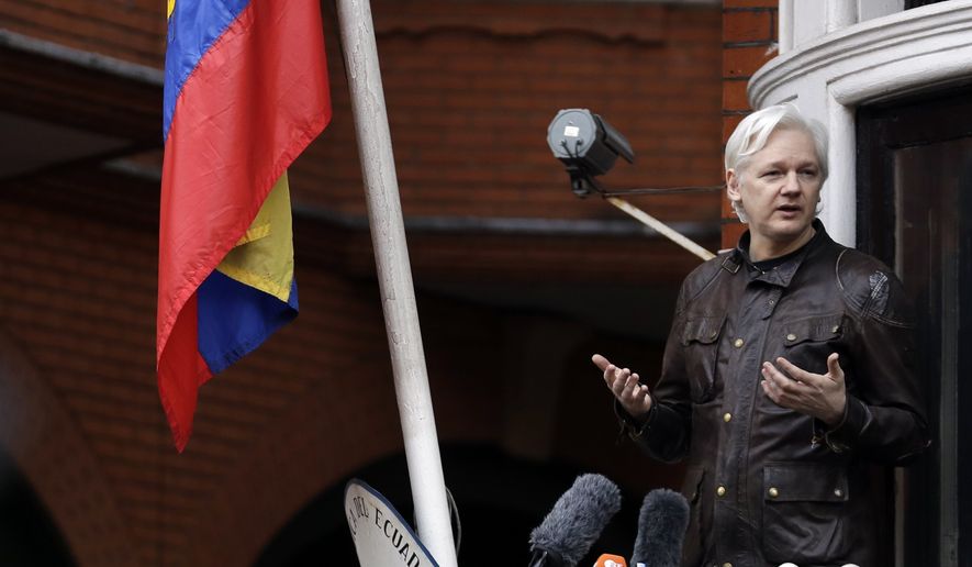 WikiLeaks founder Julian Assange gestures as he speaks on the balcony of the Ecuadorian embassy, in London, Friday May 19, 2017. (AP Photo/Matt Dunham) 