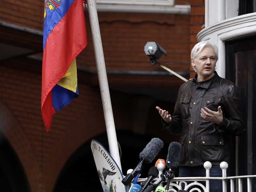 WikiLeaks founder Julian Assange gestures as he speaks on the balcony of the Ecuadorian embassy, in London, Friday May 19, 2017. (AP Photo/Matt Dunham) 