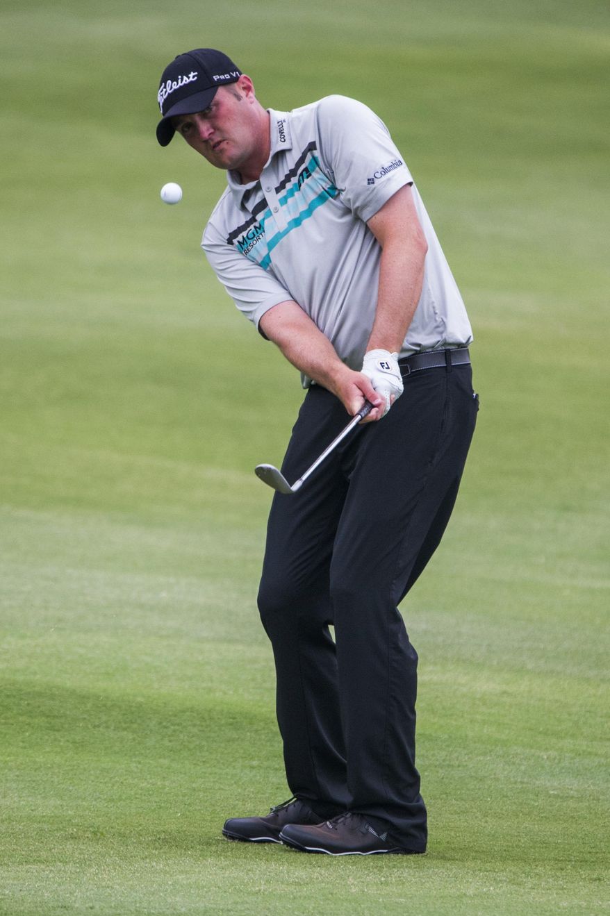 Jason Kokrak chips onto the 18th green during the second round of the Byron Nelson golf tournament at TPC Four Seasons Resort, Friday, May 19, 2017, in Irving, Texas. (Ashley Landis/The Dallas Morning News via AP)