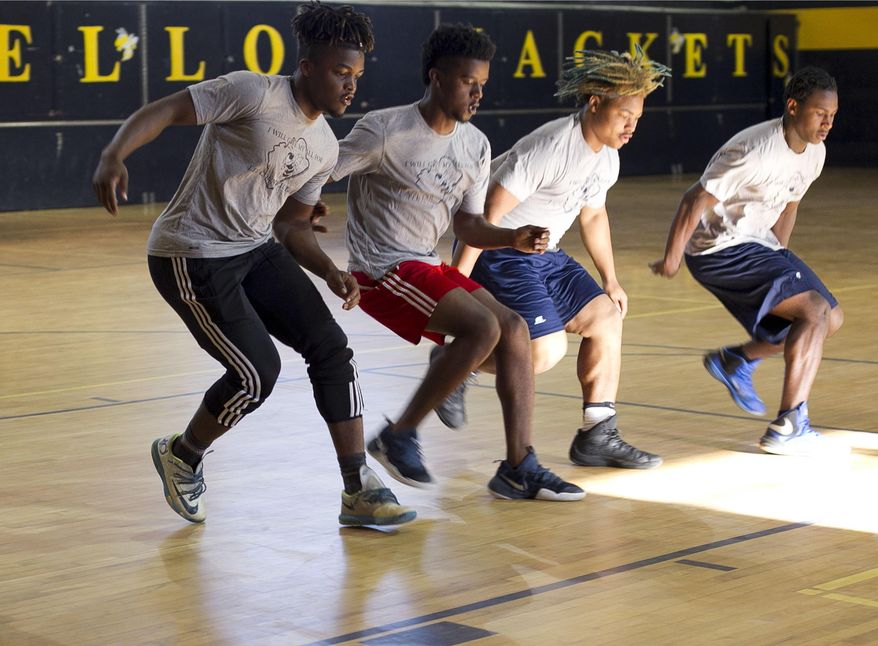 In this Tuesday, May 2, 2017, Jahmir Smith runs sprints in the gym during his first period class at Lee Senior High School in Sanford, N.C. When Lee County High School running back Jahmir Smith received his first Ivy League offer, he immediately called his mom. Monique McLean, a nurse at UNC Hospitals in Chapel Hill, was driving to work when she got the call from her second eldest son. Princeton wanted Smith to attend school and play college football there. (Robert Willett/The News & Observer via AP)