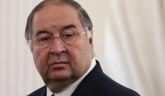 FILE - In this Thursday, Sept. 12, 2013 file photo, Uzbek-born Russian businessman Alisher Usmanov attends a meeting of Russian President Vladimir Putin and Crown Prince Sheik Mohammed bin Zayed Al Nahyan of the United Arab Emirates at the Novo-Ogaryovo state residence outside Moscow. A person familiar with the situation says Arsenal shareholder Alisher Usmanov has had an offer to buy out owner Stan Kroenke rejected. The person told The Associated Press that Usmanov&#39;s offer valued the Premier League club at $2 billion. The person spoke on condition of anonymity to discuss the club&#39;s financial matters. (Maxim Shemetov/Pool Photo via AP, File)