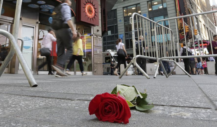 A single rose is left on the sidewalk to honor a victim of a wrong way driver in New York's Times Square, Friday, May 19, 2017. Richard Rojas, 26, charged with slamming his speeding car into pedestrians on the sidewalks of Times Square, killing a teenage tourist and injuring nearly two dozen people, said he wanted to "kill them all" and police should have shot him to stop him, a prosecutor revealed Friday. (AP Photo/Richard Drew)