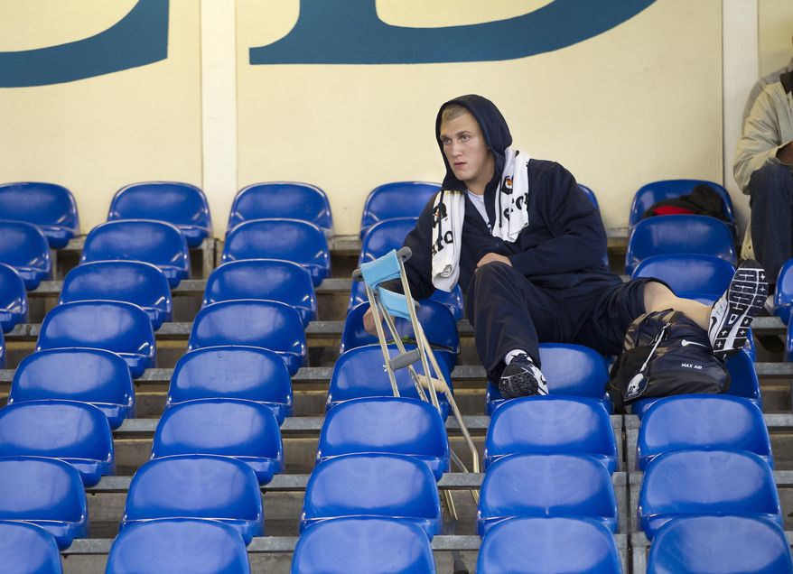 FILE - In this Aug. 27, 2014, file photo, Penn State NCAA college football injured tight end Adam Breneman watches practice from the stands at University College Dublin in Dublin, Ireland. After what turned out to be a brief but much-needed sabbatical from football, Adam Breneman has his life in order. He is on track to complete an MBA at the University of Massachusetts, playing on the same team as his best friend and heading into his last college season as one of the best tight ends in the country. (AP Photo/PennLive.com, Joe Hermitt, File)