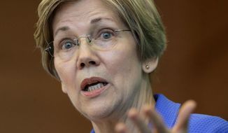 FILE- In this March 27, 2017, file photo, U.S. Sen. Elizabeth Warren, D-Mass., addresses business leaders during a New England Council luncheon in Boston. Warren is slated to deliver the commencement address at Boston’s Wheelock College on Friday, May 19. (AP Photo/Steven Senne, File)