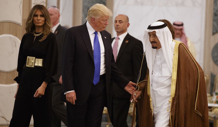 President Donald Trump and first lady Melania Trump walk with Saudi King Salman to a coffee ceremony and presentation ceremony of The Collar of Abdulaziz Al Saud Medal at the Royal Court Palace, Saturday, May 20, 2017, in Riyadh. (AP Photo/Evan Vucci)